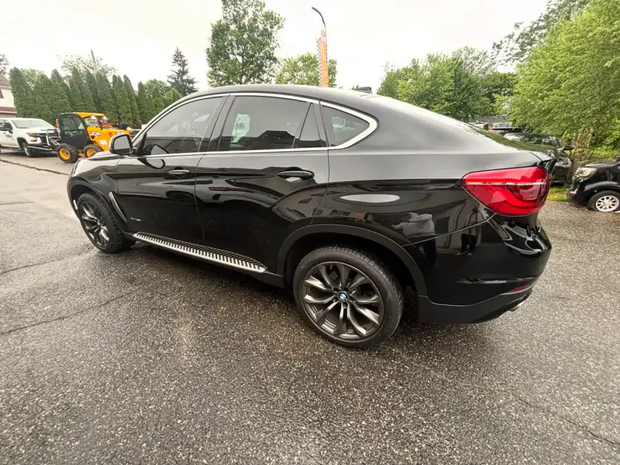 2019 BMW X6 in Black Ice after quarter panel, rocker panel and door replacement at AG Auto Body and Paint Experts in Lansdowne, PA